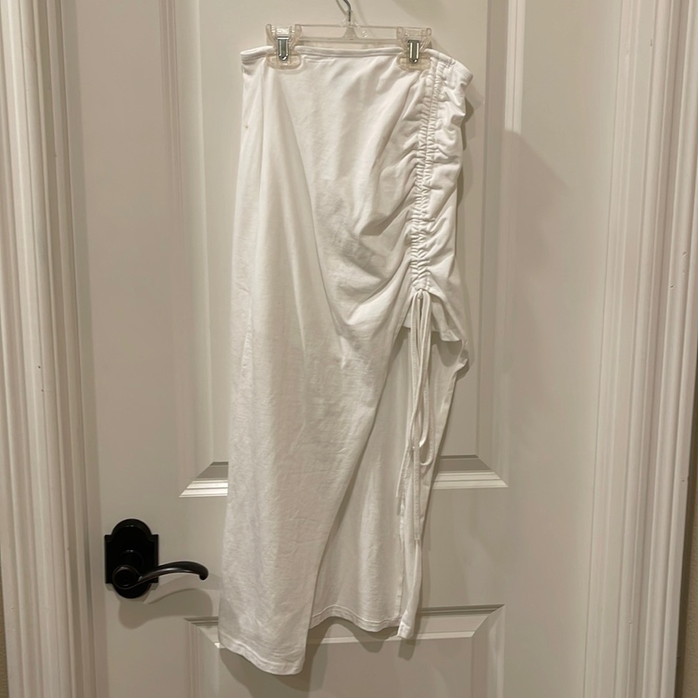 White skirt with cinching and cutout on one leg